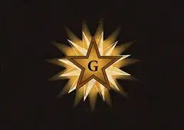 Estrella flamígera con la G en el centro.